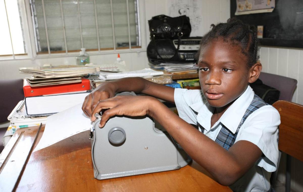 Girl learning braille