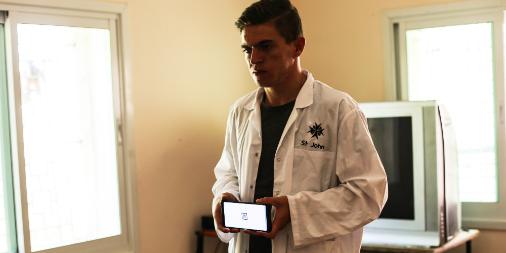 A screener for St John Eye Hospital’s RAAB Team examines a patient, West Bank. Credit/ St John Eye Hospital