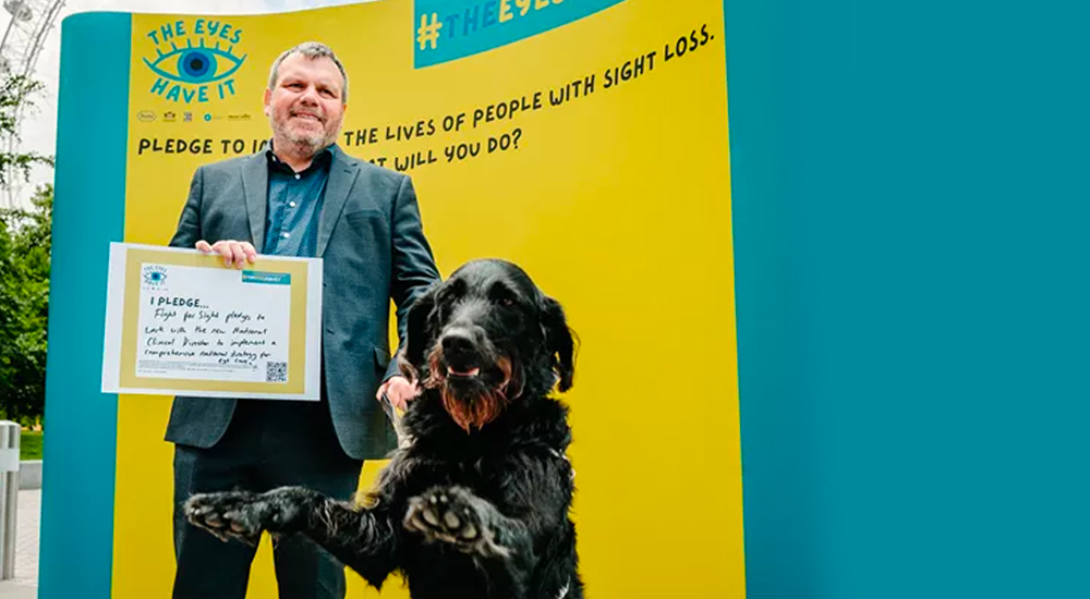 Fight for Sight CEO Keith Valentine signs the pledge wall