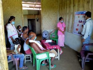 A Community Health Worker provides an education session to community members, providing more information on common eye conditions.
