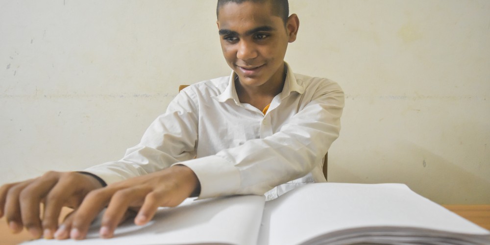 Hridoy, a 13 year-old boy who likes to read using the Braille method/Syed Sajidul Islam