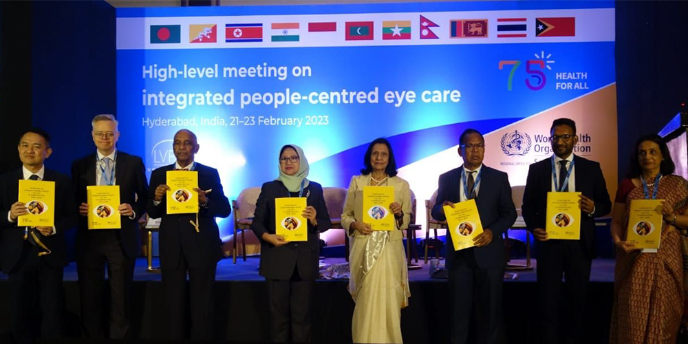 Group photo people holding guide at Day 1 of High Level meeting