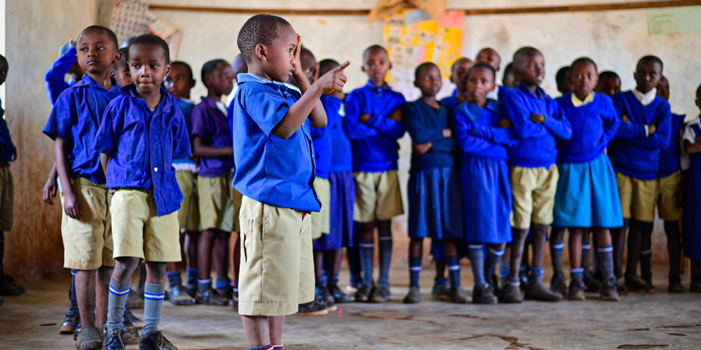 Children lining up to have their vision screened by Village HopeCore International/Gitonga Muthamaki