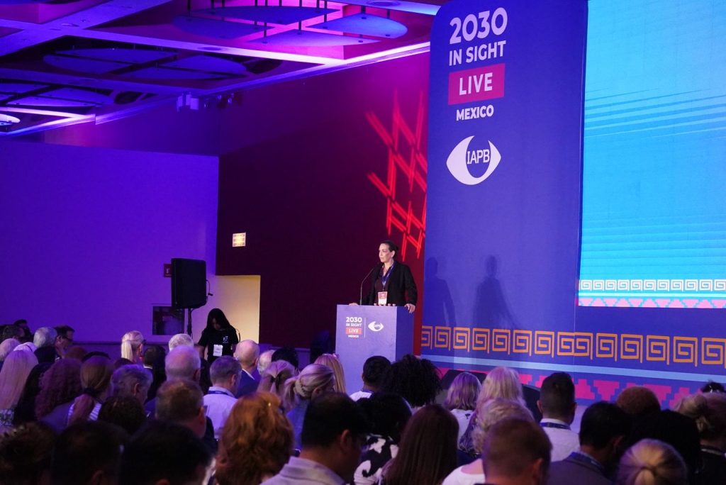 Valariea on stage behind the 2030 IN SIGHT LIVE podium.