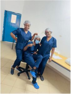 Figure 2. Petronella (left) and friends pose for photo during a practice session in theatre at the Sheikh Zayed Eye Care Centre in the Gambia.