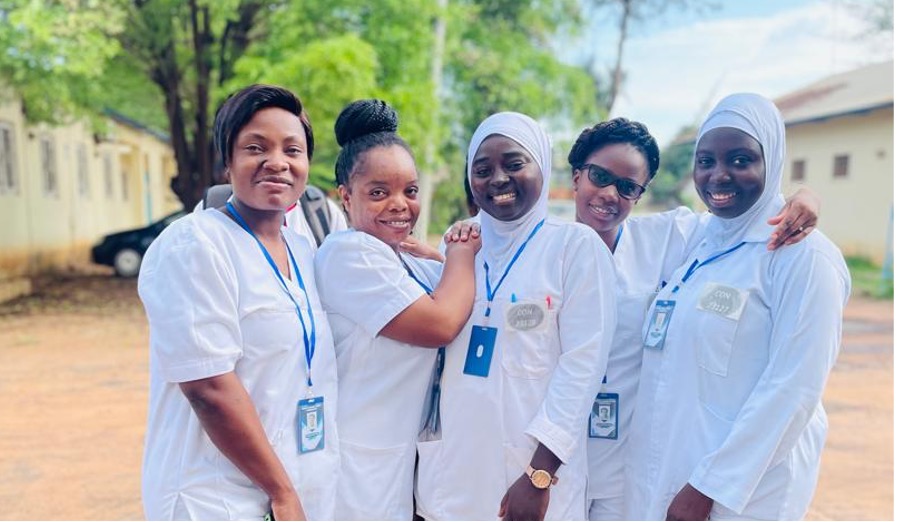 Petronella (left) pose for a photo during practical sessions in the Gambia