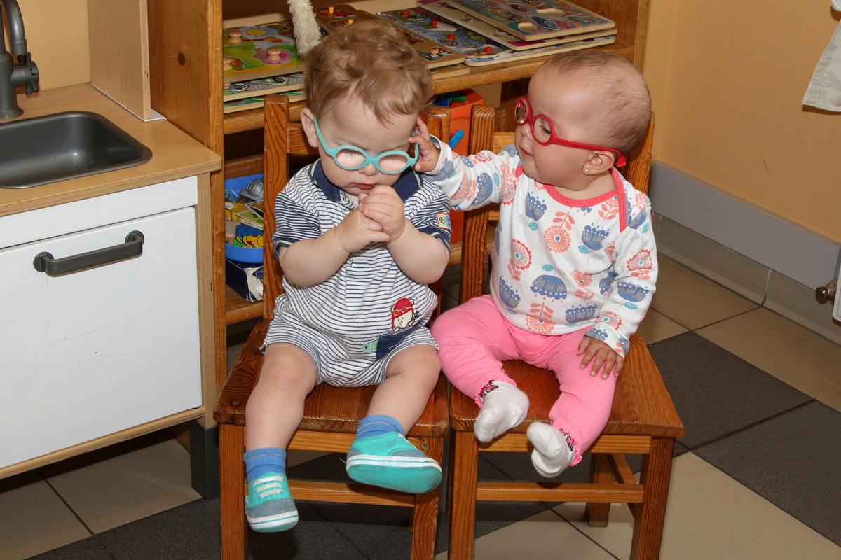 Two infants with glasses