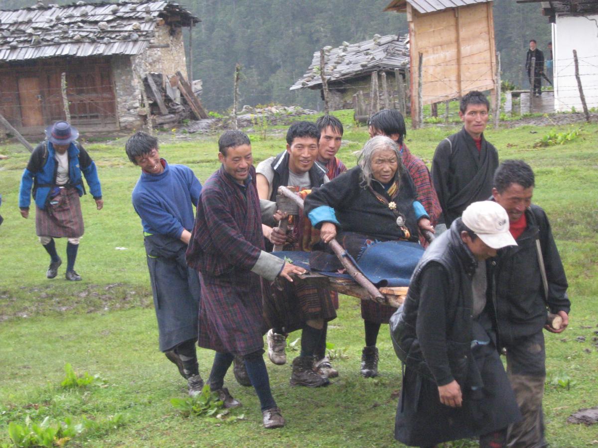 Old lady being carried to an eye hospital