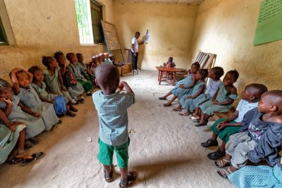 Checking the vision of a class of children in a rural government school in Sierra Leone