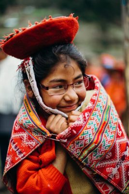 A Peruvian girl celebrates her new glasses with a smile