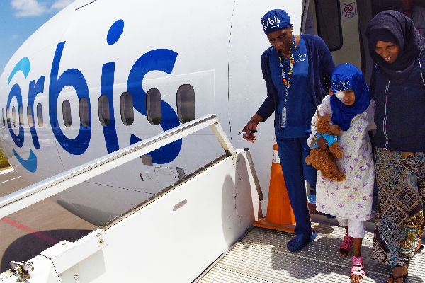 Disembarking from the plane/ Photo Geoff Oliver Bugbee