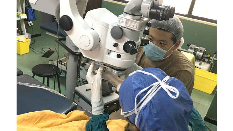 Story: Kellogg Eye Center for International Ophthalmology in Ethiopia/Retinal Surgeon Phil Lieu supervises a retinal surgery with resident trainee at St Paul's