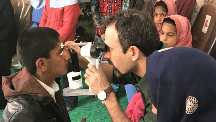 Examining children on suspicion of trachoma/ Story: Eliminating Trachoma: WHO announces sustained progress