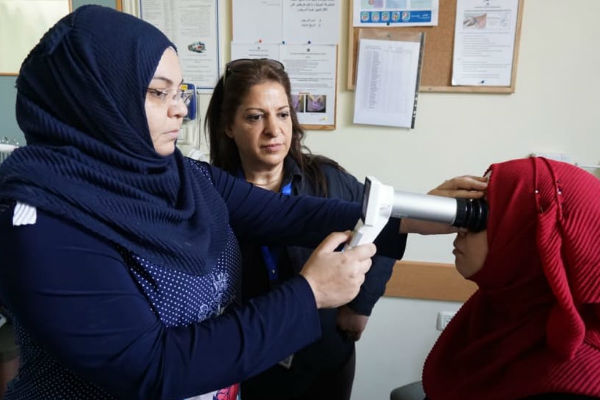 Fida Abu Ali Project Coordinator trains our Muristan Clinic Manager on how to use the DR Fundus Came