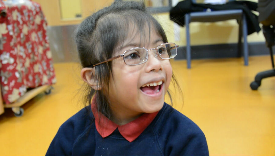 Girl with glasses/ Story: Poor eyesight and hearing loss costs billions in the UK