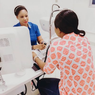 A nurse examines a patient