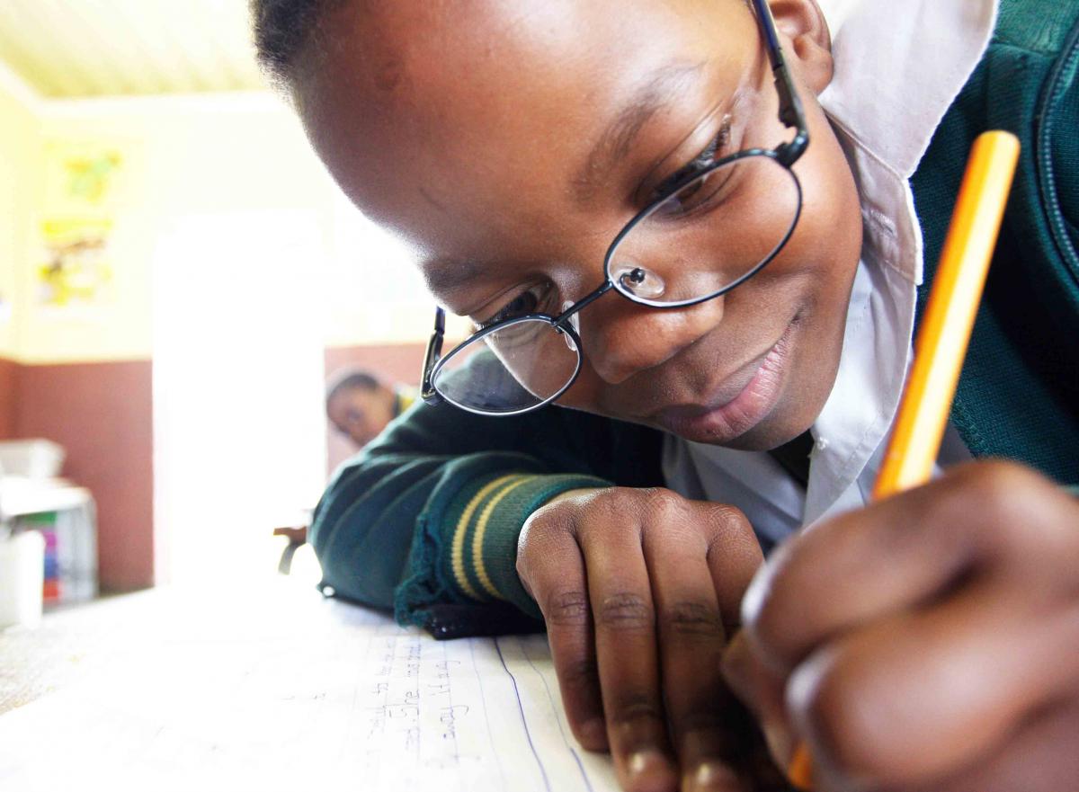 Young boy writing