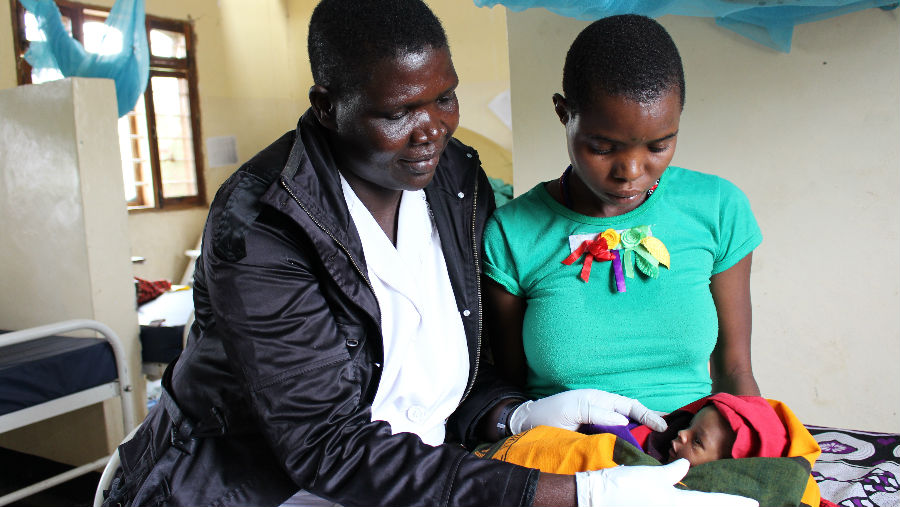 Nurse examining young childs eyes