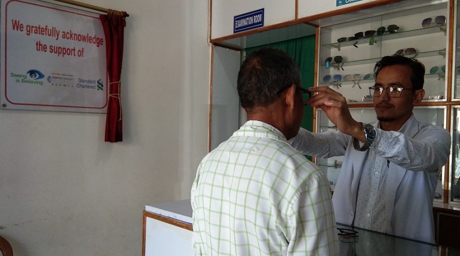 A patient is fitted for spectacles in the Sarupathar Vision Centre in the Assam state of India. 