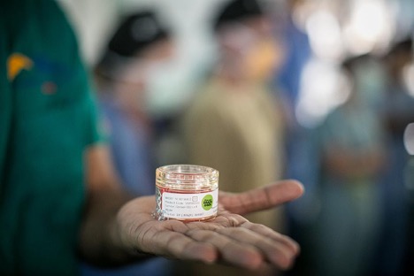 Holding a sample at the eye bank