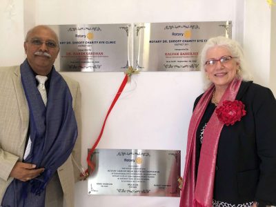 Raheem Rahmathullah with Victoria Sheffield with plaque