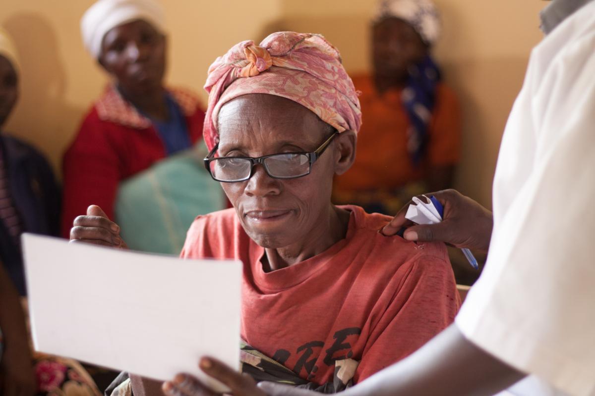 Lady trying to read with her spectacles