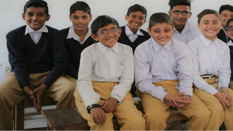 School children in Pakistan pose for a photo