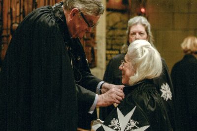 Victoria receiving the rank of Dame by Lord Prior, 2013
