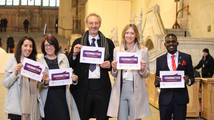 VAO hosts call to action event at House of Commons, London/At House of Commons, holding placards of VisionMatters