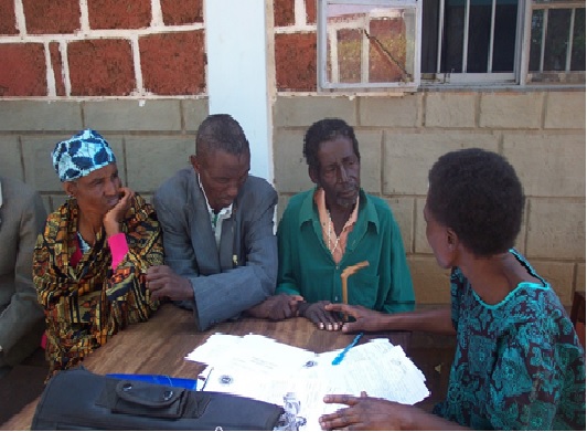 Sr. Ndossi counseling a family regarding cataract surgery in Arumeru District in Arusha Region, Tanzania